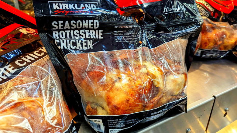 The Kirkland Signature Rotisserie Chicken under the heat lamps in the bag it comes in