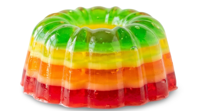 A Jell-O dish molded like a Bundt cake pan sitting on a white surface.