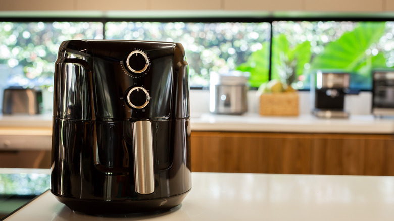 Black and gold air fryer on the kitchen counter