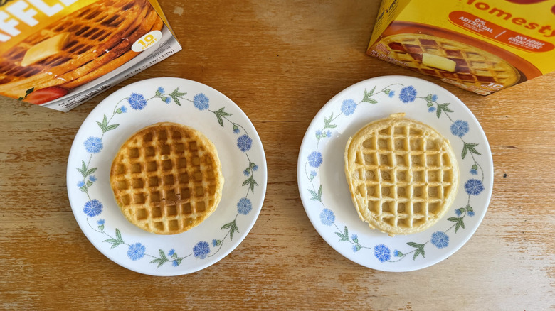 one of each waffle on a small plate, their boxes looming in the background