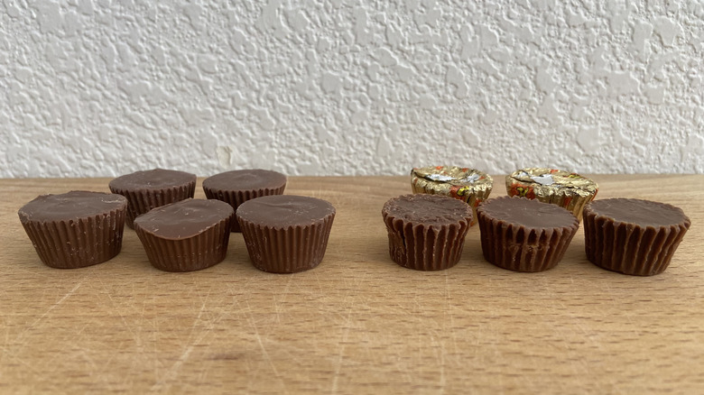 five of each kind of peanut butter cup on a wooden cutting board