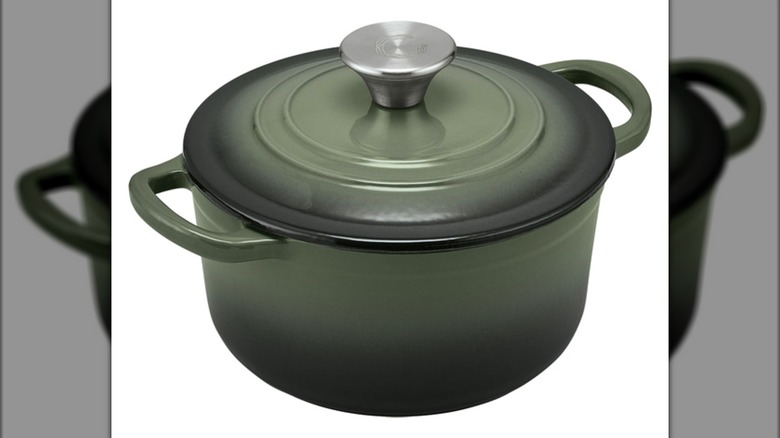 Green Crofton Cast Iron Dutch Oven with lid attached on white background