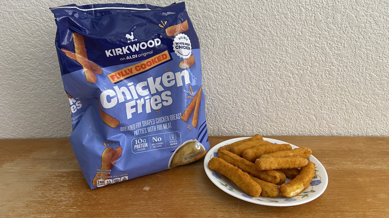 pile of Aldi Chicken Fries on small plate beside their bag