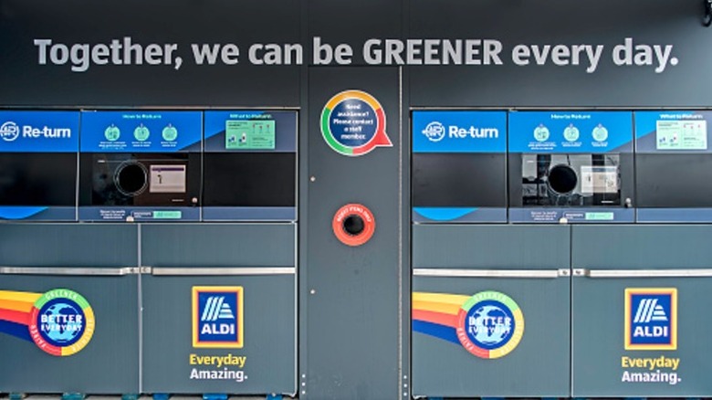 Aldi recycling bins that say "together, we can be greener everyday"