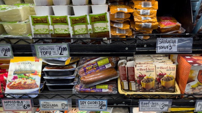 Trader Joe's shelf with vegan meats, prepared meals, and tofu