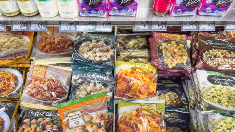 Frozen section in Trader Joe's with various bags of frozen prepared pasta meals