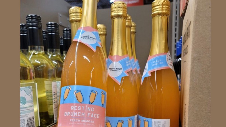 Bottles of Aldi Resting Brunch Face mimosa on store shelf display