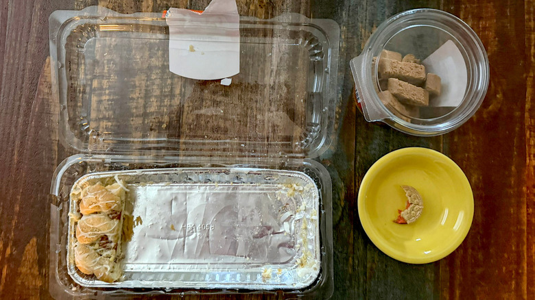 leftovers on table from eating Aldi pumpkin spice items, including biscotti, cookie, and danish