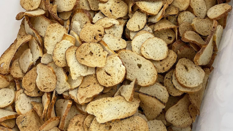A huge pile of bagel chips sits in a container
