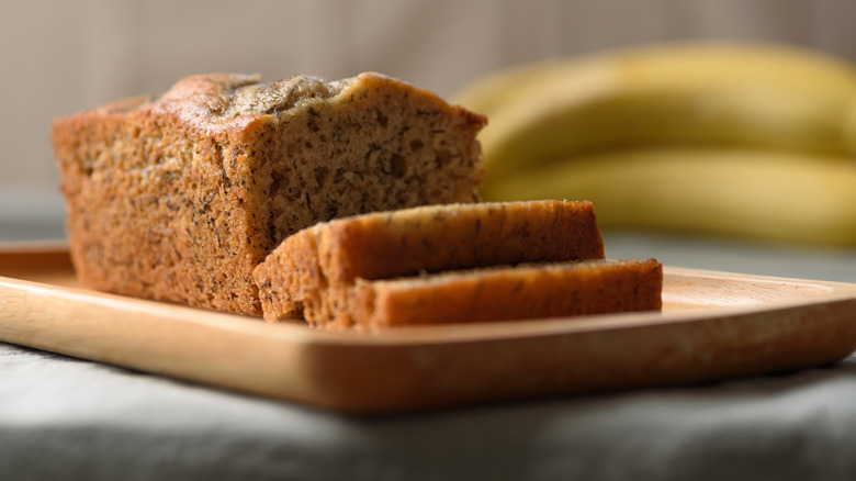 Banana bread sits on a cutting board