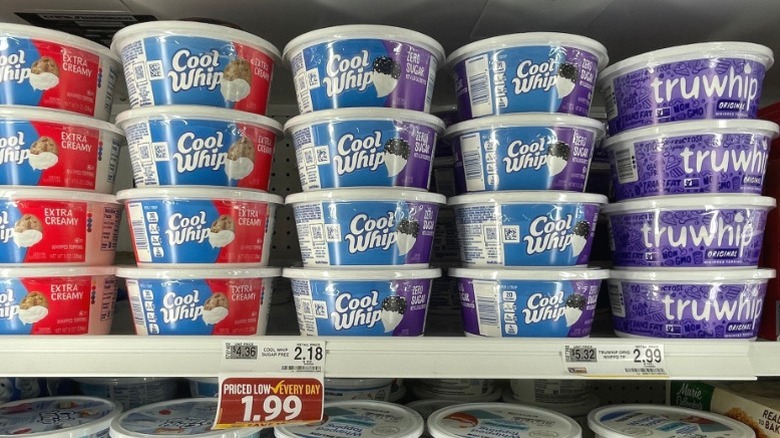 Containers of Cool Whip on a supermarket shelf.