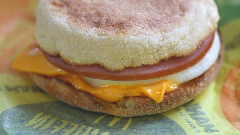 An Egg McMuffin sits on its wrapper