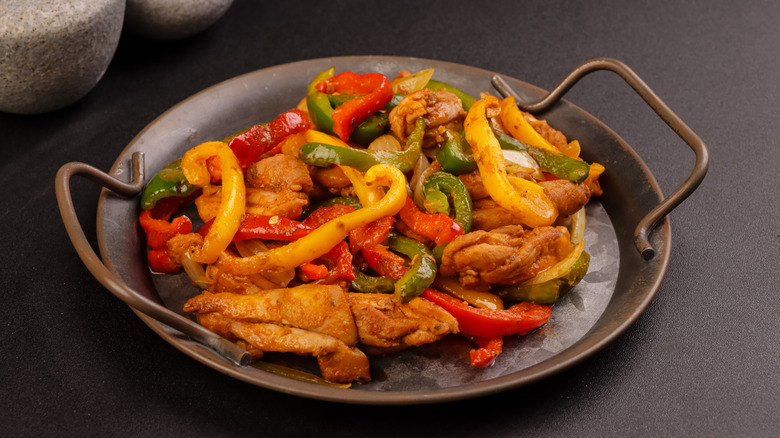 Fajitas sit on a serving tray