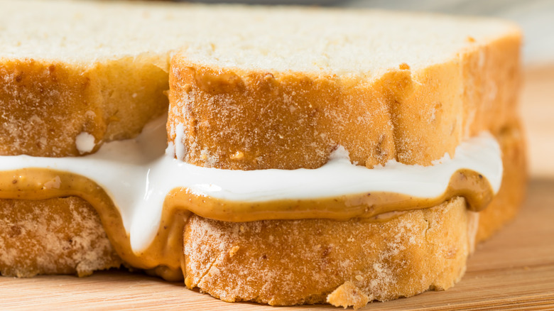Closeup of marshmallow cream and peanut butter between two pieces of bread