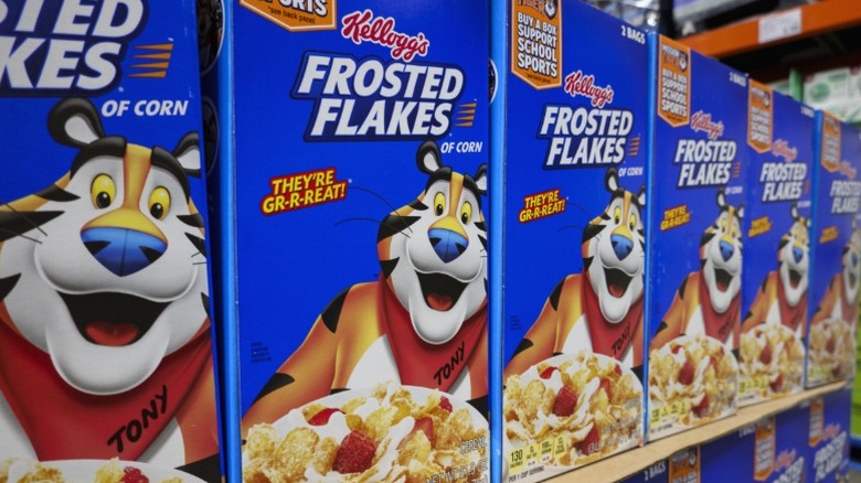 Boxes of Frosted Flakes on a supermarket shelf.