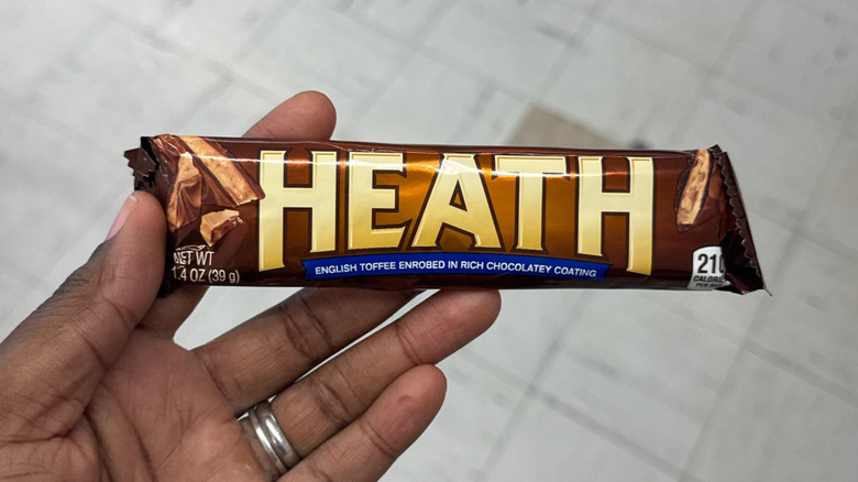 holding a heath bar