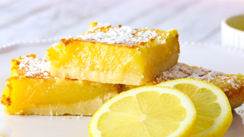 two lemon bar cookies and lemon slices