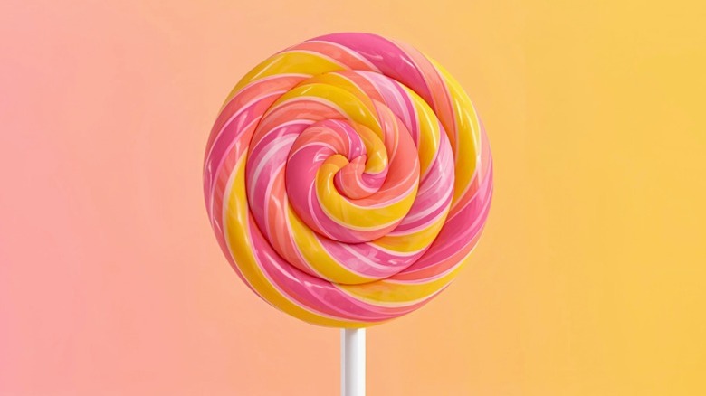 A swirly pink and yellow lollipop.