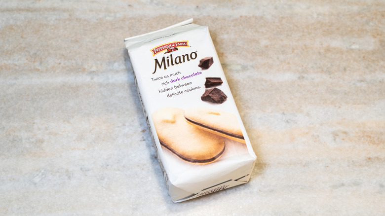 A package of Milano cookies sits on a marbled surface