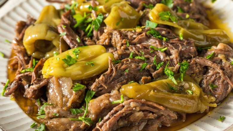 Mississippi Pot Roast served with peppers and potatoes.
