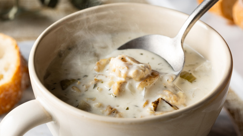 New England clam chowder in bowl with spoon