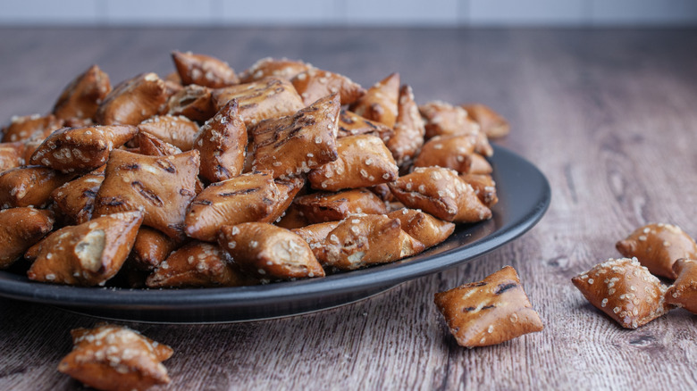 Peanut butter pretzels sit on a plate