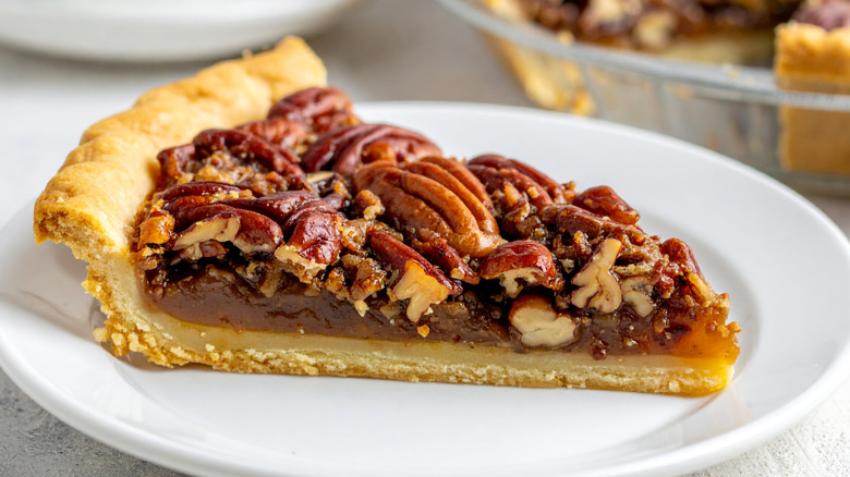 Slice of pecan pie on plate