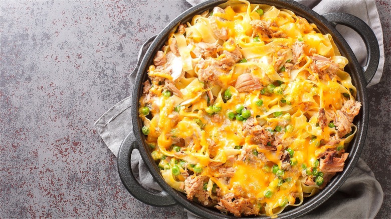 Top-down view of tuna noodle casserole in a cast-iron pan with handles