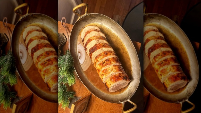 sliced turducken in a metal dish