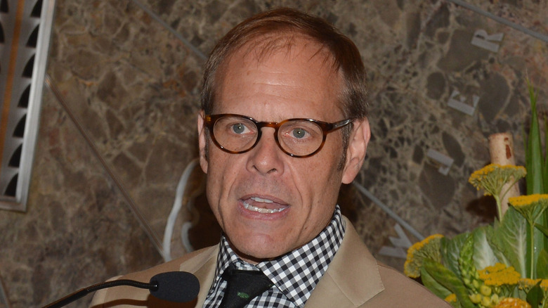 Alton Brown speaks at an Empire State Building lighting ceremony in New York City in 2012
