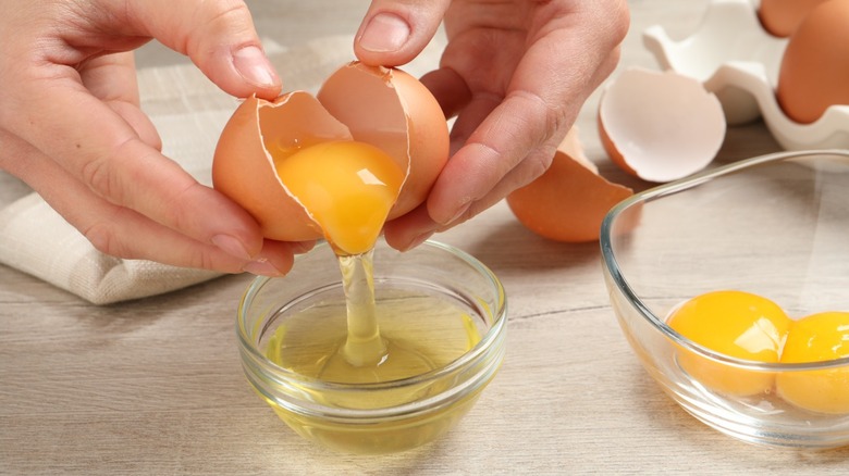 Egg yolks being separated from egg white