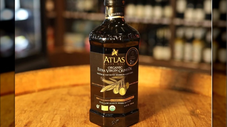 Bottle of Atlas Extra Virgin Olive Oil on wood table