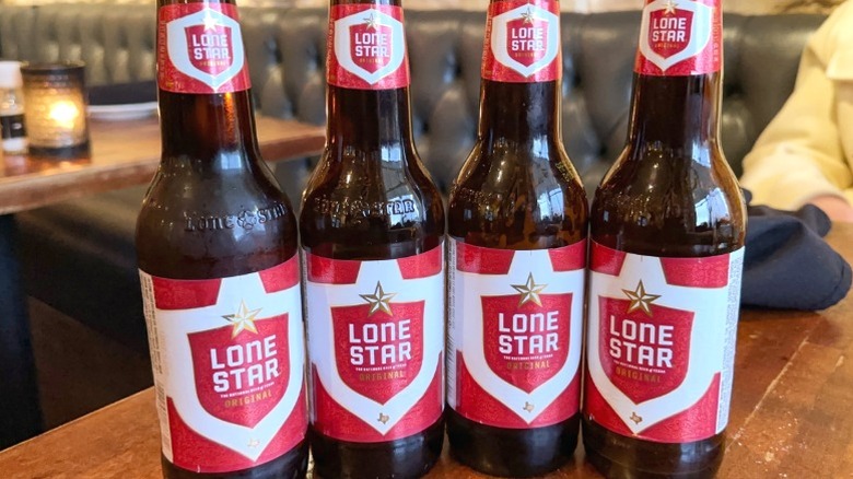 Bottles of Lone Star beer on a table.