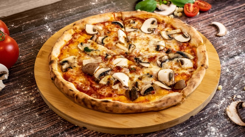 Pizza topped with mushrooms