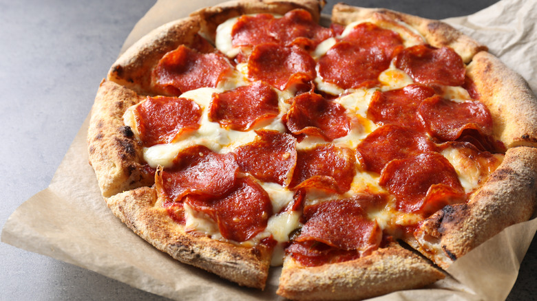 Freshly-baked pizza topped with cheese and pepperoni