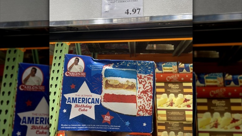 box containing Carlo's Bakery's The Ultimate American Birthday Cake shown inside a Costco store
