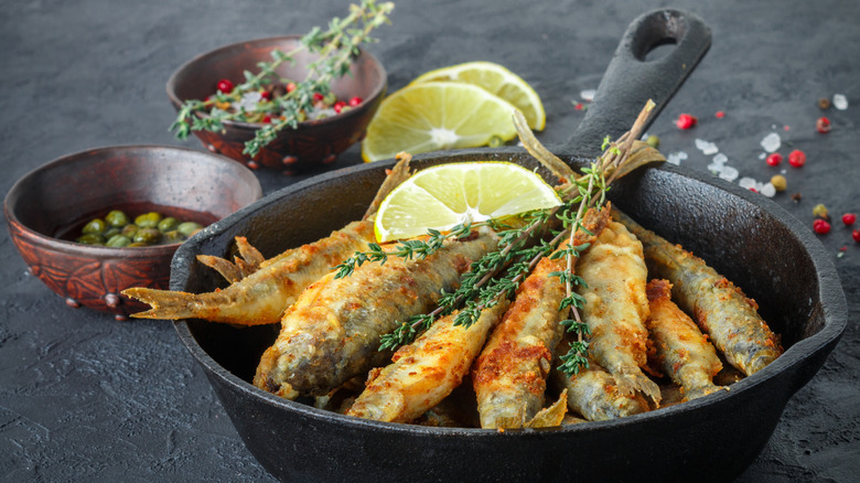 Smelts in a cast iron frying pan