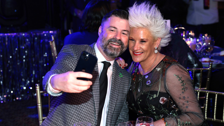 Anne Burrell &Stuart Claxton attending a party
