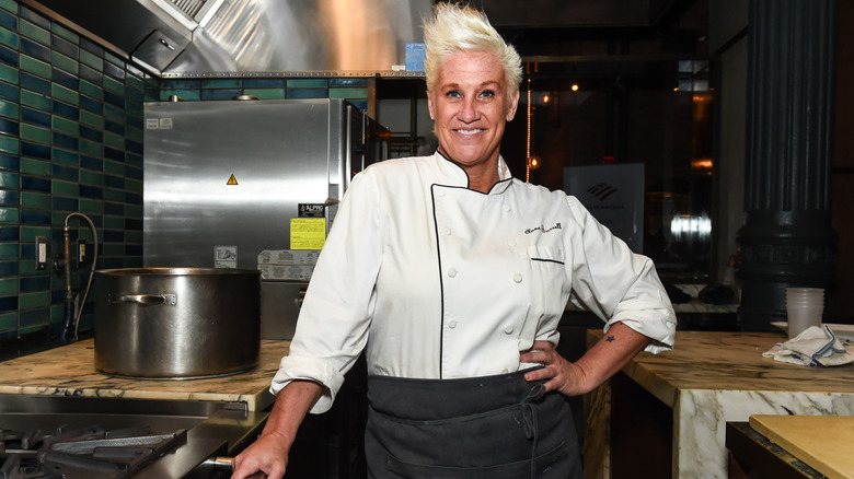 Anne Burrell in kitchen with hand on hip