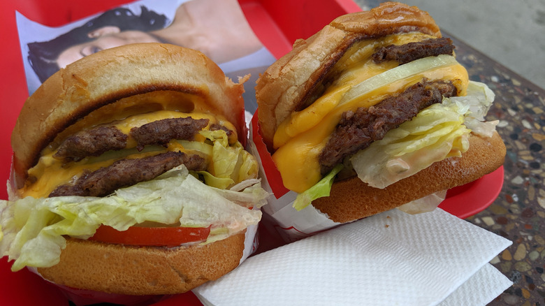 Two Double-Double burgers that have been cooked animal style.