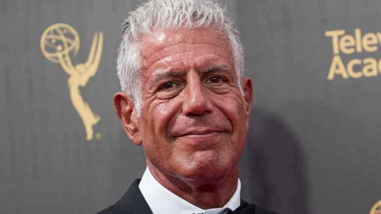 Anthony Bourdain smiling at a red carpet event