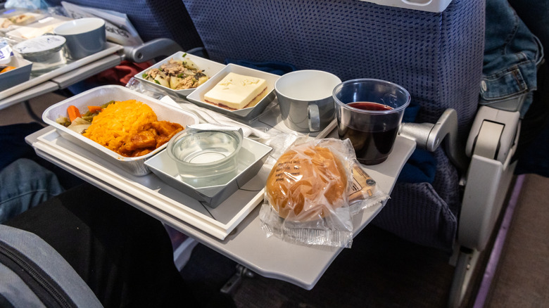 An airplane meal on a seat-back tray