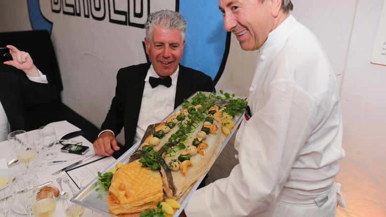 Anthony Bourdain admires seafood feast by Boulud