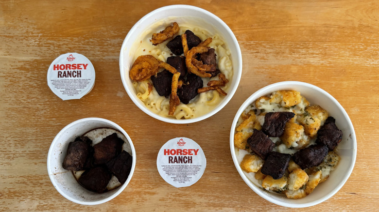 Arby's Steak 'n Mac Bowl, Steak 'n Potato Bowl, and Steak Nuggets with two Horsey Ranch sauces