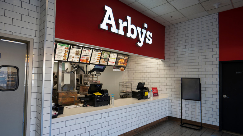 The counter of an Arby's restaurant with no one close to it.
