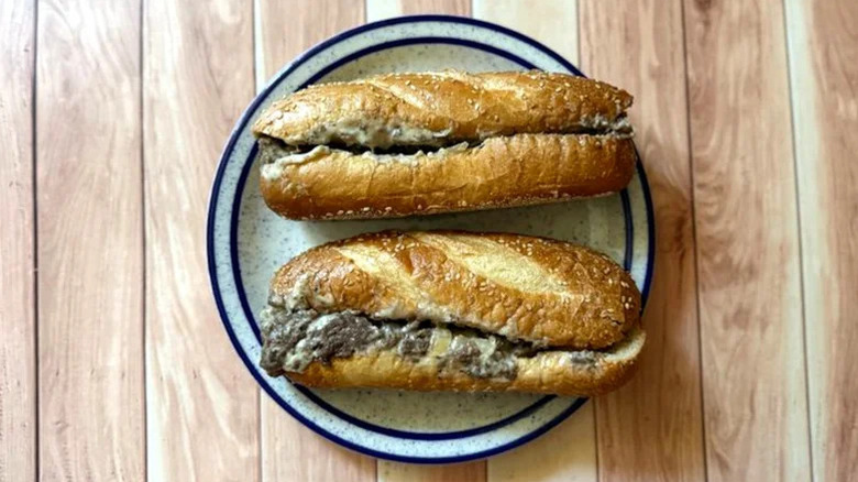 Arby's Cheesesteak on plate on wooden table.