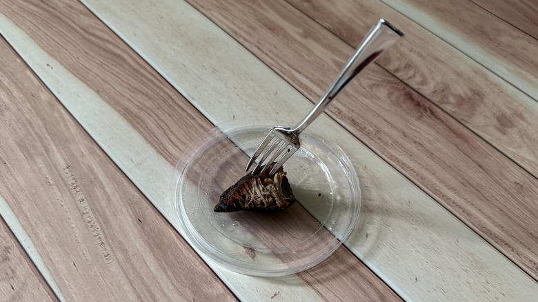 A bite taken out of a Steak Nugget with a fork sticking out of it