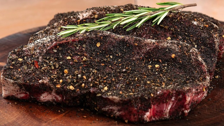 Charcoal rubbed steak with fresh rosemary