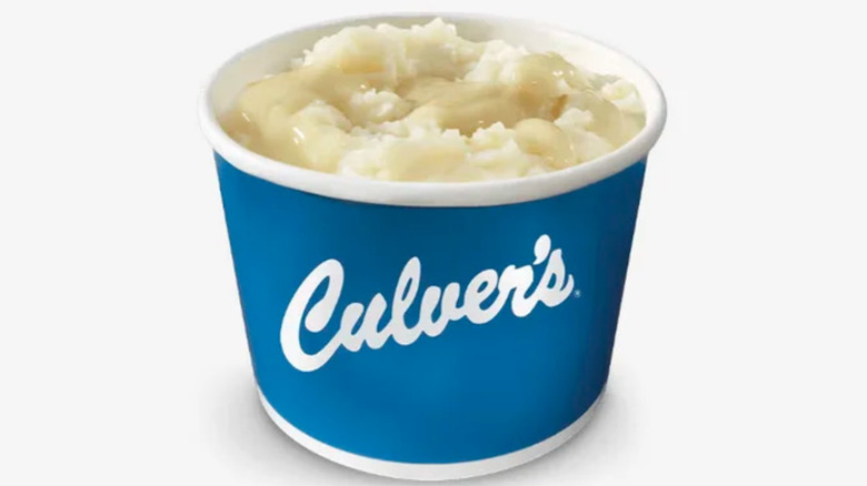 Blue container of mashed potatoes and chicken gravy from Culver's