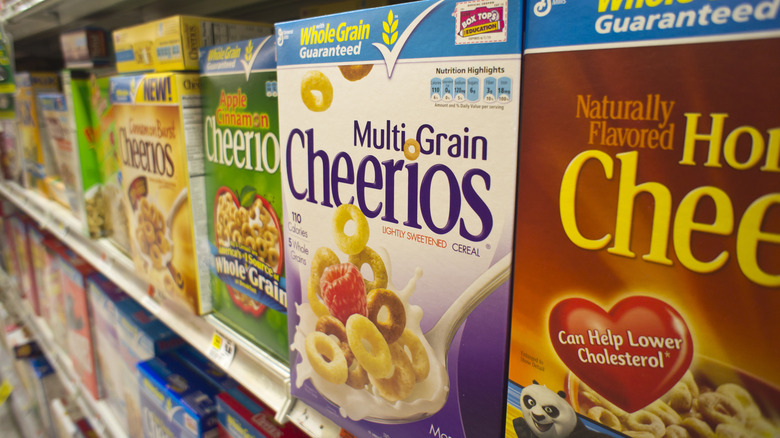 Boxes of cereal on a store shelf.